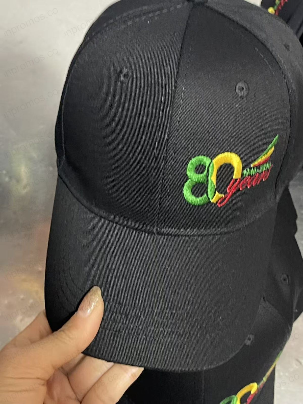 Black cap with detailed embroidery — production photo