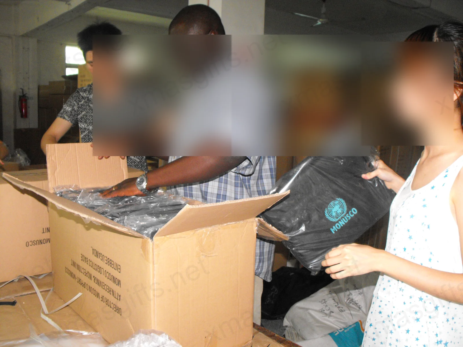 Team packing MONUSCO goods into cartons